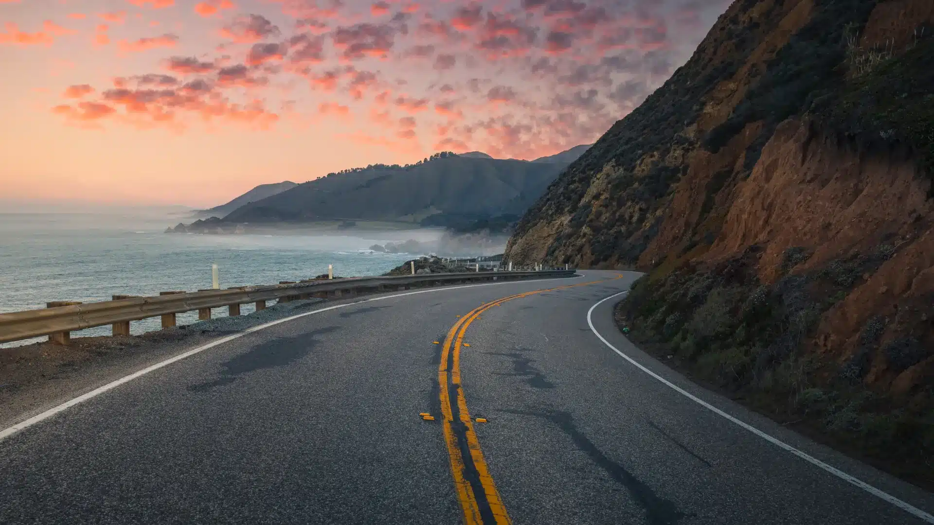 Winding Pacific Coast Highway in Malibu during sunset